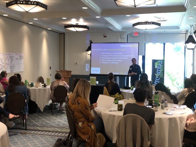 Employee building communication confidence during an Arizona improv workshop with Joe Hammer